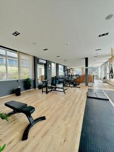 a gym with several exercise equipment in a room at Departamento Veneto Village, Parque Siquiman, Carlos Paz in Villa Parque Siquiman