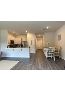 a kitchen and living room with a table and chairs at Air Home , New Jersey, year 2023 in Sicklerville