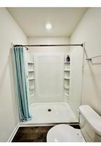 a small bathroom with a toilet and a shower at Air Home , New Jersey, year 2023 in Sicklerville
