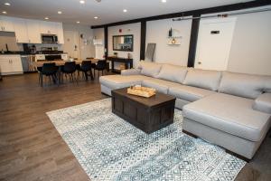 a living room with a couch and a table at Gunstock Inn & Suites in Gilford