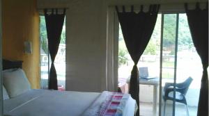 Postel nebo postele na pokoji v ubytování Bahia B&B