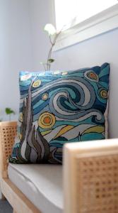 a pillow sitting on top of a couch at White Caps Kaikoura Farmstay in Kaikoura