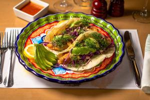 a plate of food sitting on top of a table at Camino Real Aeropuerto in Mexico City