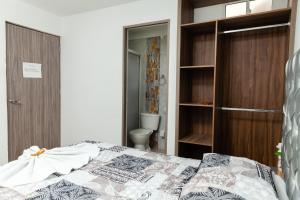 Postel nebo postele na pokoji v ubytování Apartaestudios Galanni