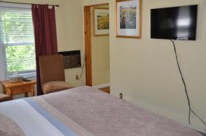 Кровать или кровати в номере Cornwall Inn