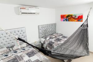 Postel nebo postele na pokoji v ubytování Apartaestudios Galanni