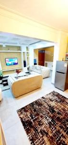 a large living room with a couch and a television at Nyali Luxury in Mombasa