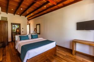 Ένα ή περισσότερα κρεβάτια σε δωμάτιο στο BK Beach Boutique Hotel - Hikkaduwa