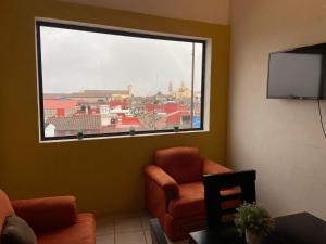 TV a/nebo společenská místnost v ubytování Hotel Quinta Luna Zacatlán