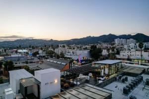 an aerial view of a city with buildings and mountains at Luxury 2Bed/2Bath Apt in West Hollywood w/ Rooftop in Los Angeles