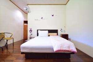 Ліжко або ліжка в номері Chin Shan B&B