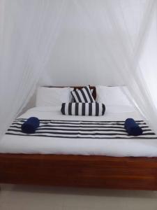 Postel nebo postele na pokoji v ubytování Sadew Home Stay