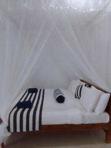 Postel nebo postele na pokoji v ubytování Sadew Home Stay