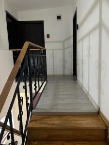 a stairway with a door in a building at EVA's Rooms in Târgu-Mureş