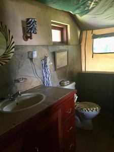 a bathroom with a sink and a toilet at Buffalo's Rest Greenpark-Naivasha in Naivasha
