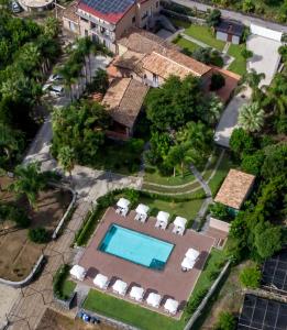 an aerial view of a house with a swimming pool at Virdamuri - Etna Country Resort in Giarre