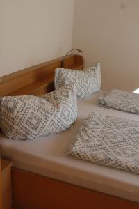 two beds with pillows on top of each other at Haus Schröcker in Gaschurn