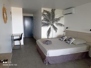Voodi või voodid majutusasutuse Nouveau Domaine de Mabouya vue mer et proximité plage toas