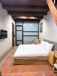 Postel nebo postele na pokoji v ubytování First Floor Inn Kinmen