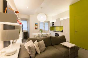 a living room with a couch and a table at Tortona Citylife Washington M4 in Milan +9 photos