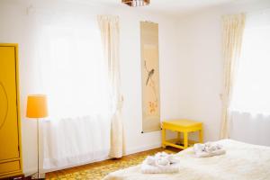 a bedroom with two beds with towels on them at Landhaus am Schloss in Schnabelwaid +51 photos