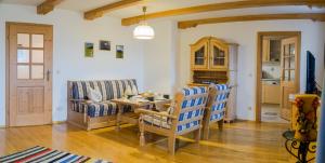 a living room with a couch and a table at Maurerhof in Ruhpolding