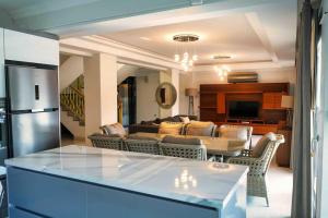 a living room with a couch and a table at LUXURY VILLA FOUR FOURLEX (YALOVA) in Termal