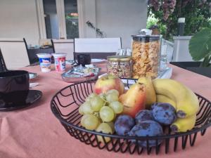 a basket of fruit on top of a table at Vikendica Nika in Rab