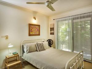 a bedroom with a bed and a window at Bushland retreat in Gold Coast