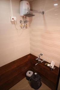 a bathroom with a sink and a toilet at SAVI 4BHK VILLA ALIBAUG in Alibaug