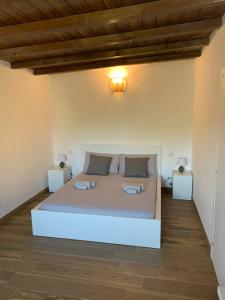 a bedroom with a bed and two night stands at Chalet al Mare in Civitavecchia