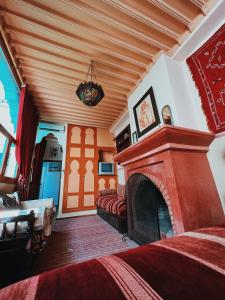 Postel nebo postele na pokoji v ubytování Riad Al Nour