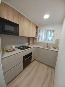 Kuchyň nebo kuchyňský kout v ubytování Apartamento Roc Mar
