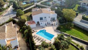 an aerial view of a house with a swimming pool at Apartments in a "VILLA VISTA JAVEA" in Jávea