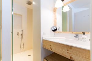 a bathroom with a sink and a shower at Can Roca Nou in Mahón