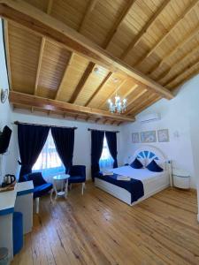 Postel nebo postele na pokoji v ubytování MAVİ PALAS HOTEL