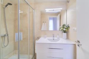 a bathroom with a sink and a shower at Apartamento Premium en Centro Histórico, luminoso y acogedor in Málaga +20 photos