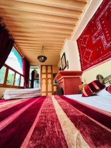 Postel nebo postele na pokoji v ubytování Riad Al Nour