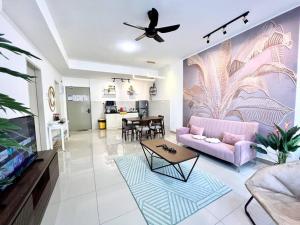 a living room with a pink couch and a table at New Condo Bali- 1BR/4Pax/2Carpark nr jonker encore in Melaka