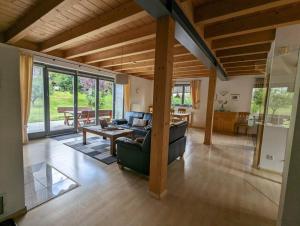 a living room with a couch and a table at Ferienhaus Ketterer Hinterzarten in Hinterzarten