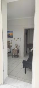 a living room with a couch and a table at ANASTASIA studio in Kavala