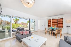 a living room with a couch and a table at Casa Birdie By Kura Homes in Marbella