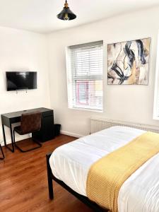 Uma cama ou camas num quarto em Grey Eagle Apartments Shoreditch