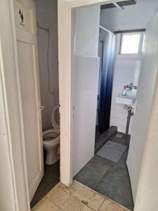 a bathroom with a toilet and a sink at jerusalem city couple,group and family friendly hostel in Jerusalem