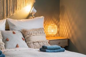 Voodi või voodid majutusasutuse LITELIVING Familiensuite BoHo toas