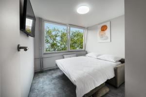 Postel nebo postele na pokoji v ubytování Berlin Studios