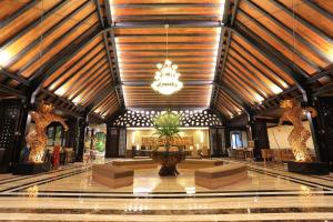 a lobby with a large building with a chandelier at Ijen Suites Resort & Convention in Malang