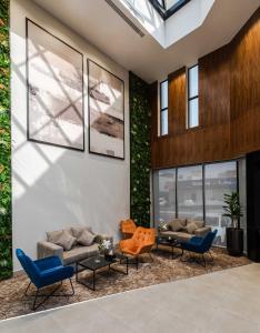 a lobby with couches and chairs in a building at شقق ممسى المخدومة in Riyadh