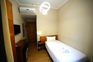 Postel nebo postele na pokoji v ubytování Hotel Montevecchio