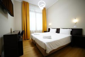 Postel nebo postele na pokoji v ubytování Hotel Montevecchio